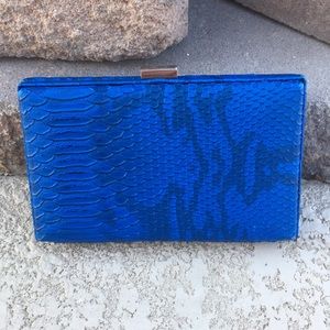 Faux snake skin clutch